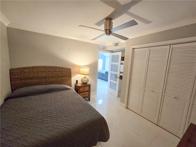 a bedroom with a bed and a walk in closet