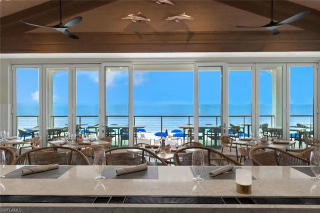 a kitchen with a dining table and chairs