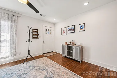 a view of a kitchen with a sink and a stove top oven