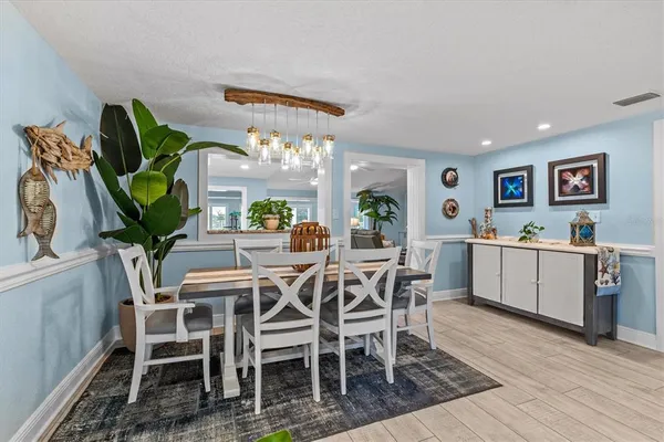 a kitchen with lots of counter top space a sink appliances and cabinets