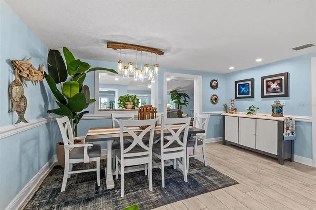 a kitchen with lots of counter top space a sink appliances and cabinets