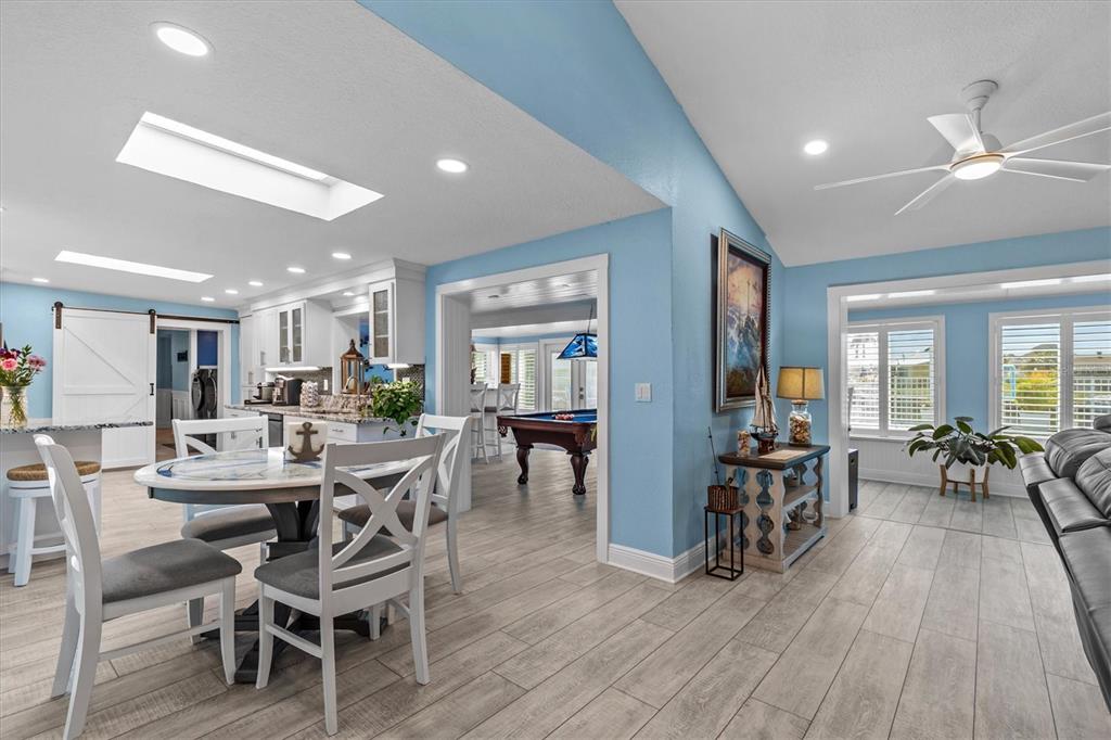 4387 6th Isle Drive Hernando Beach, FL 34607 - Photo 16 of 89 a view of a dining room with furniture and wooden floor