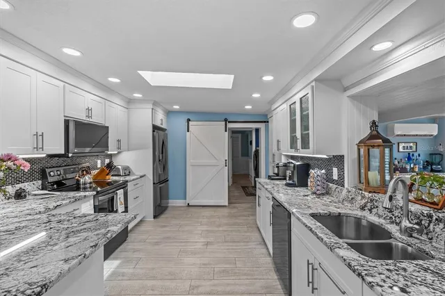 a living room with hard wood flooring and a couch