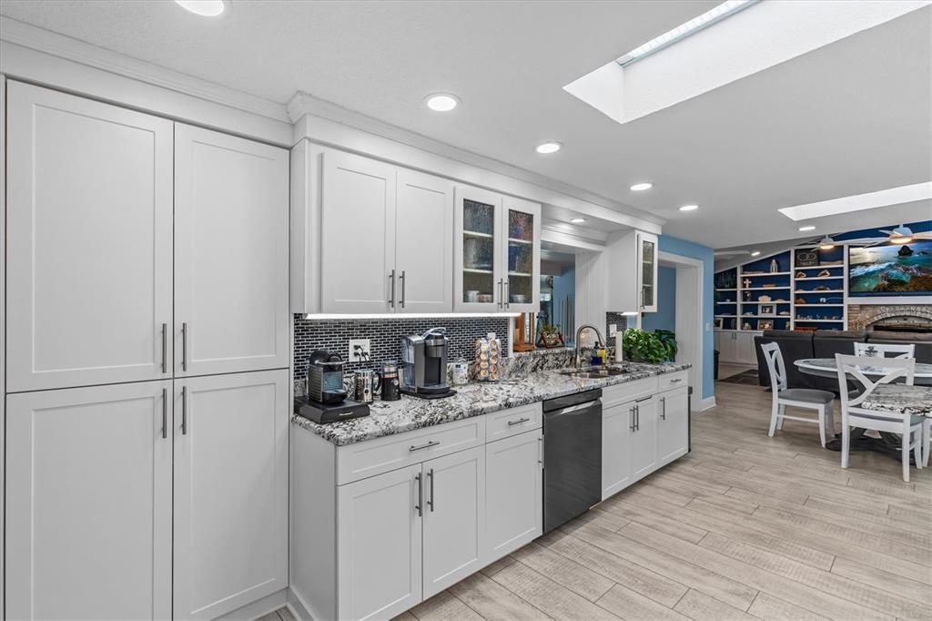 4387 6th Isle Drive Hernando Beach, FL 34607 - Photo 19 of 98 a kitchen with stainless steel appliances granite countertop refrigerator sink and cabinets