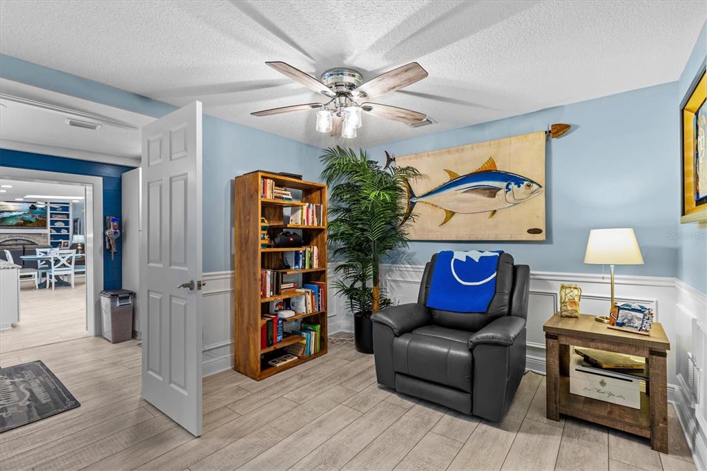4387 6th Isle Drive Hernando Beach, FL 34607 - Photo 37 of 89 a living room with hard wood flooring and a couch