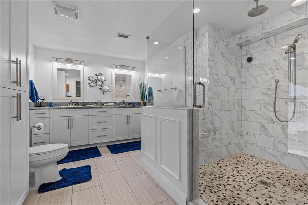 4387 6th Isle Drive Hernando Beach, FL 34607 - Photo 44 of 89 a bathroom with a sink a toilet and shower