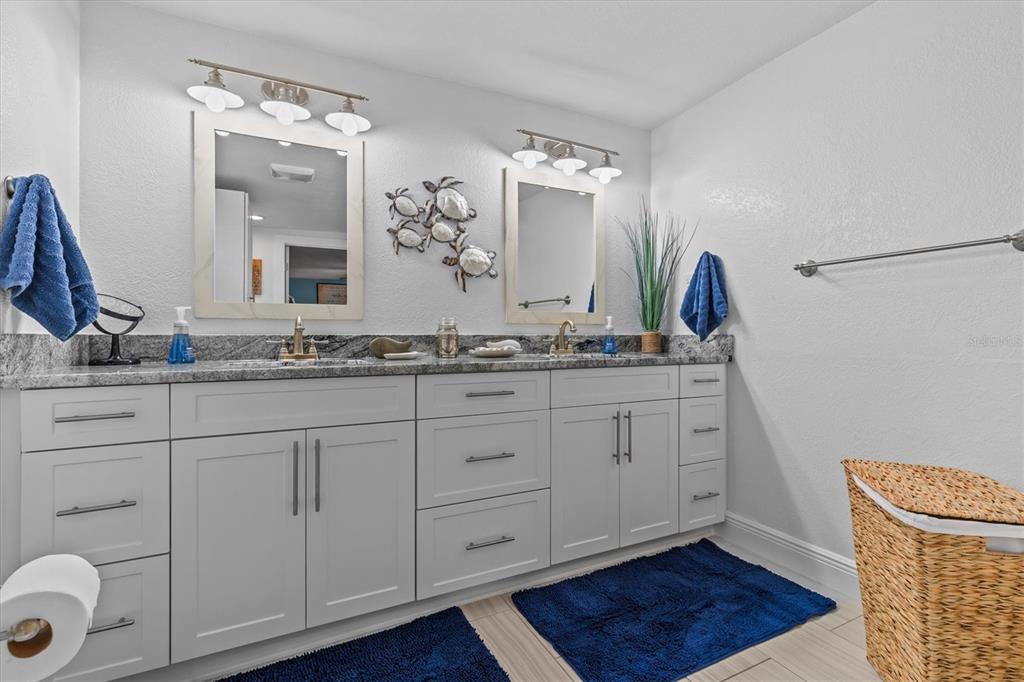 4387 6th Isle Drive Hernando Beach, FL 34607 - Photo 45 of 98 a bathroom with a sink and a mirror