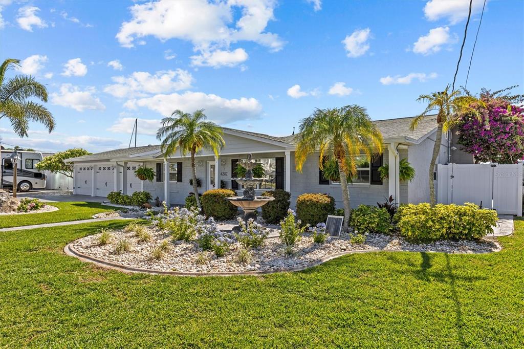 4387 6th Isle Drive Hernando Beach, FL 34607 - Photo 5 of 98 a view of a house with swimming pool and sitting area