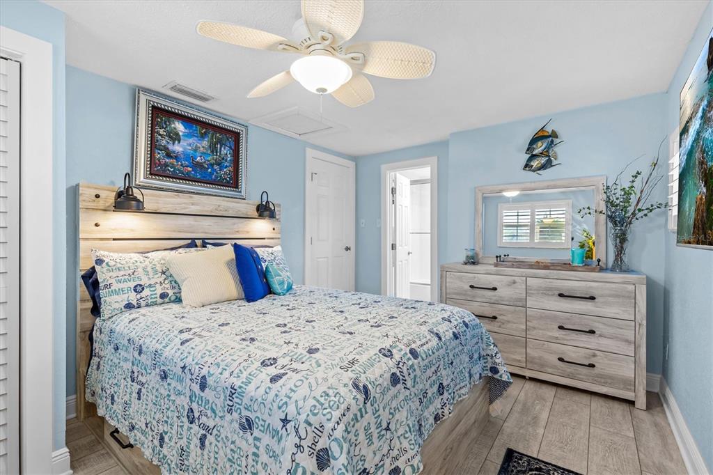 4387 6th Isle Drive Hernando Beach, FL 34607 - Photo 52 of 98 a bedroom with a bed and a dresser