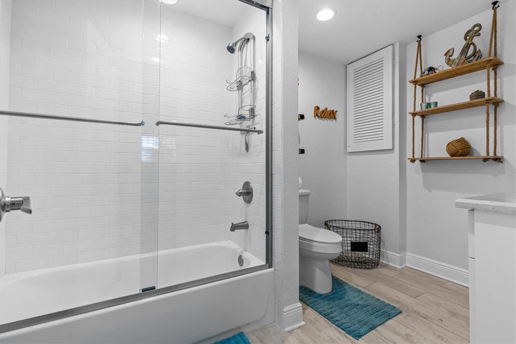 4387 6th Isle Drive Hernando Beach, FL 34607 - Photo 53 of 98 a bathroom with a shower a toilet and a shower