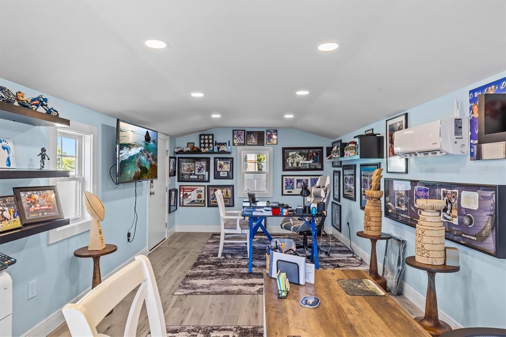 4387 6th Isle Drive Hernando Beach, FL 34607 - Photo 69 of 89 a living room with lots of furniture and wooden floor