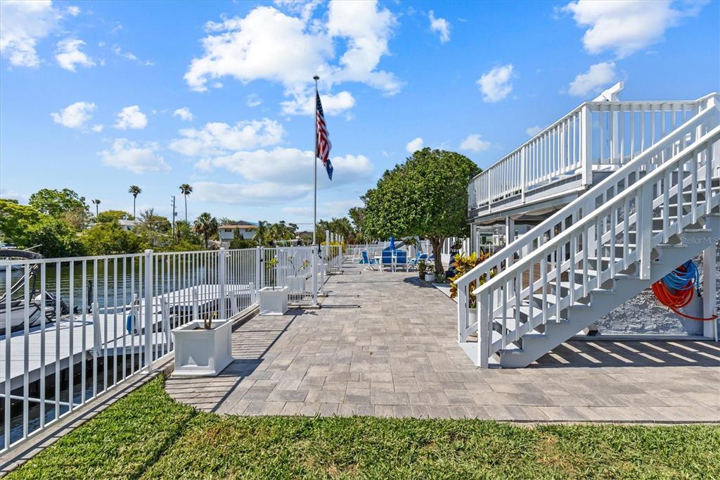 4387 6th Isle Drive Hernando Beach, FL 34607 - Photo 70 of 89 a view of a house with backyard and sitting area