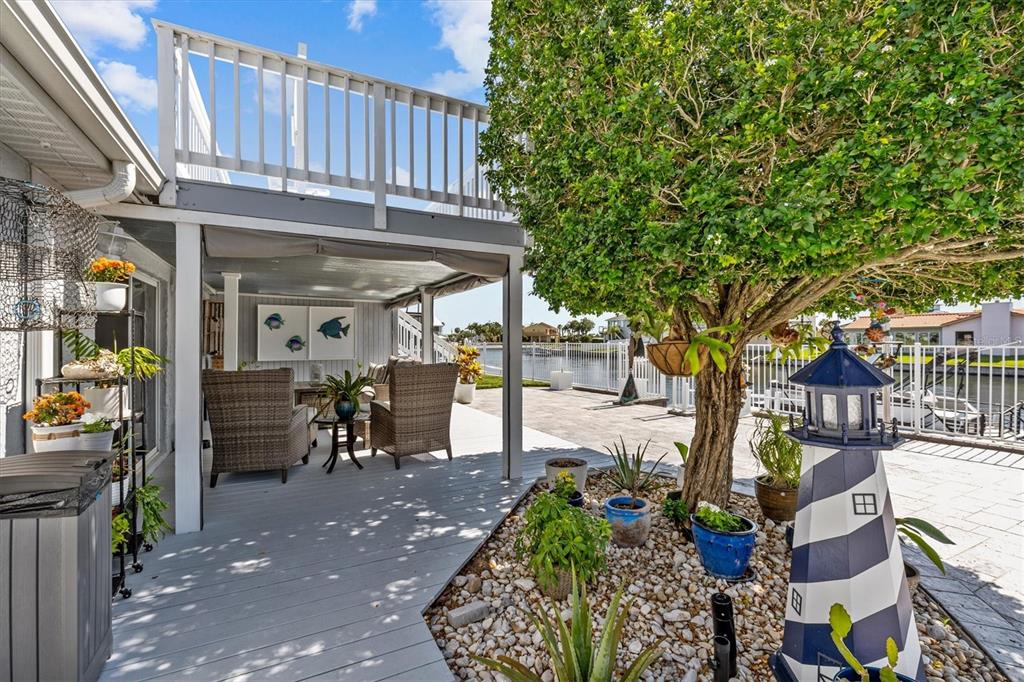 4387 6th Isle Drive Hernando Beach, FL 34607 - Photo 78 of 89 a view of a chairs and table in the patio