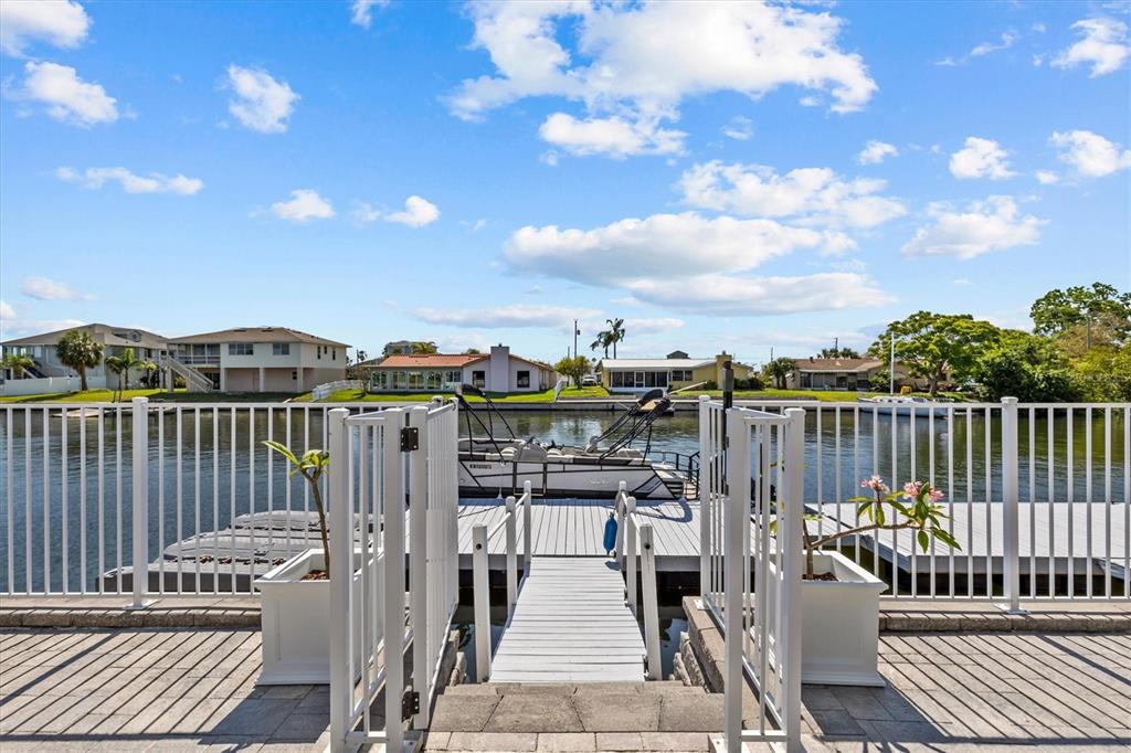 4387 6th Isle Drive Hernando Beach, FL 34607 - Photo 85 of 98 a view of a balcony with two chairs