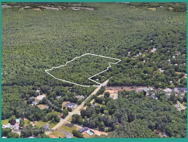 a aerial view of a house with a yard