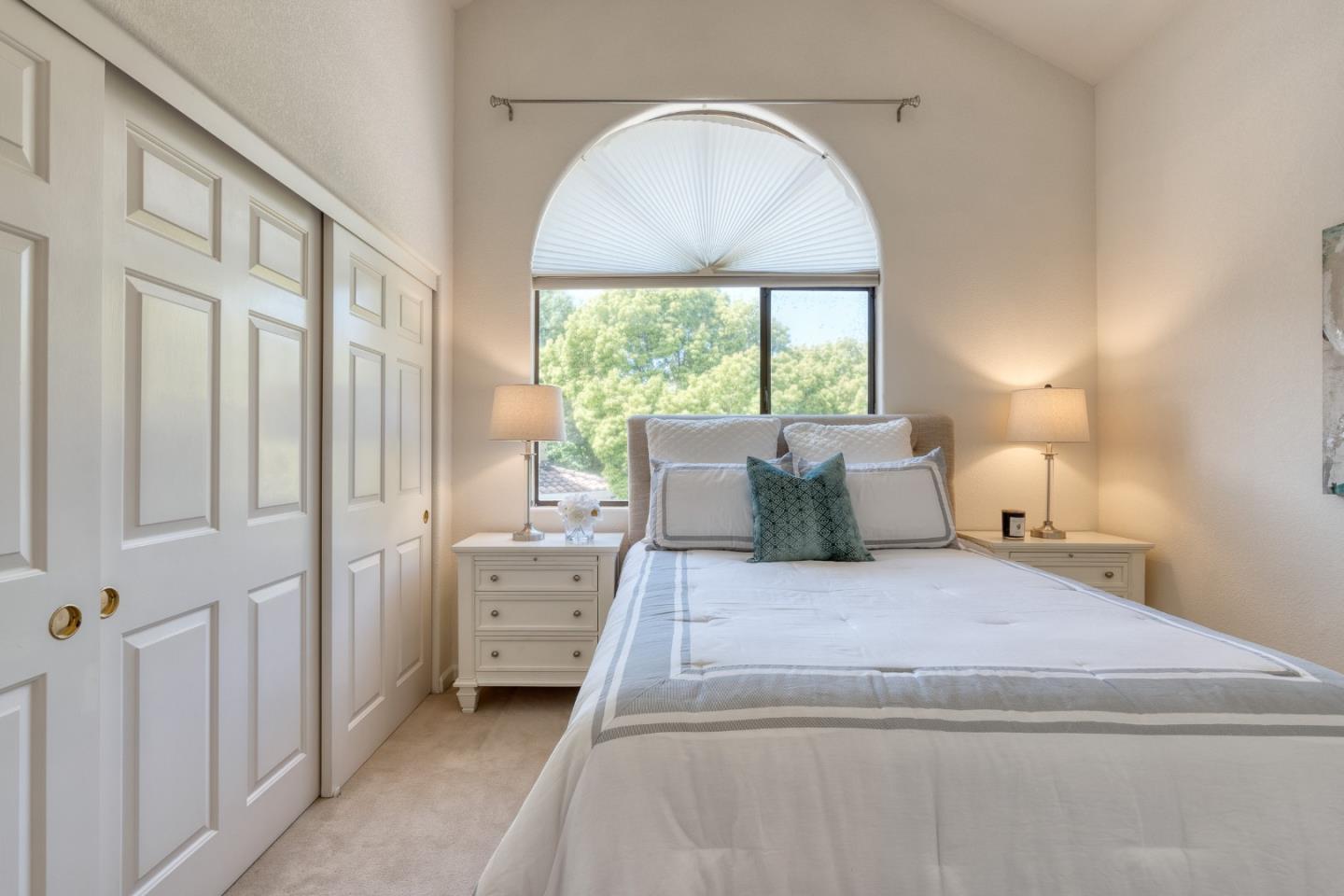 7 Iris Lane San Carlos, CA 94070 - Photo 21 of 22 a large bed sitting in a bedroom next to a window