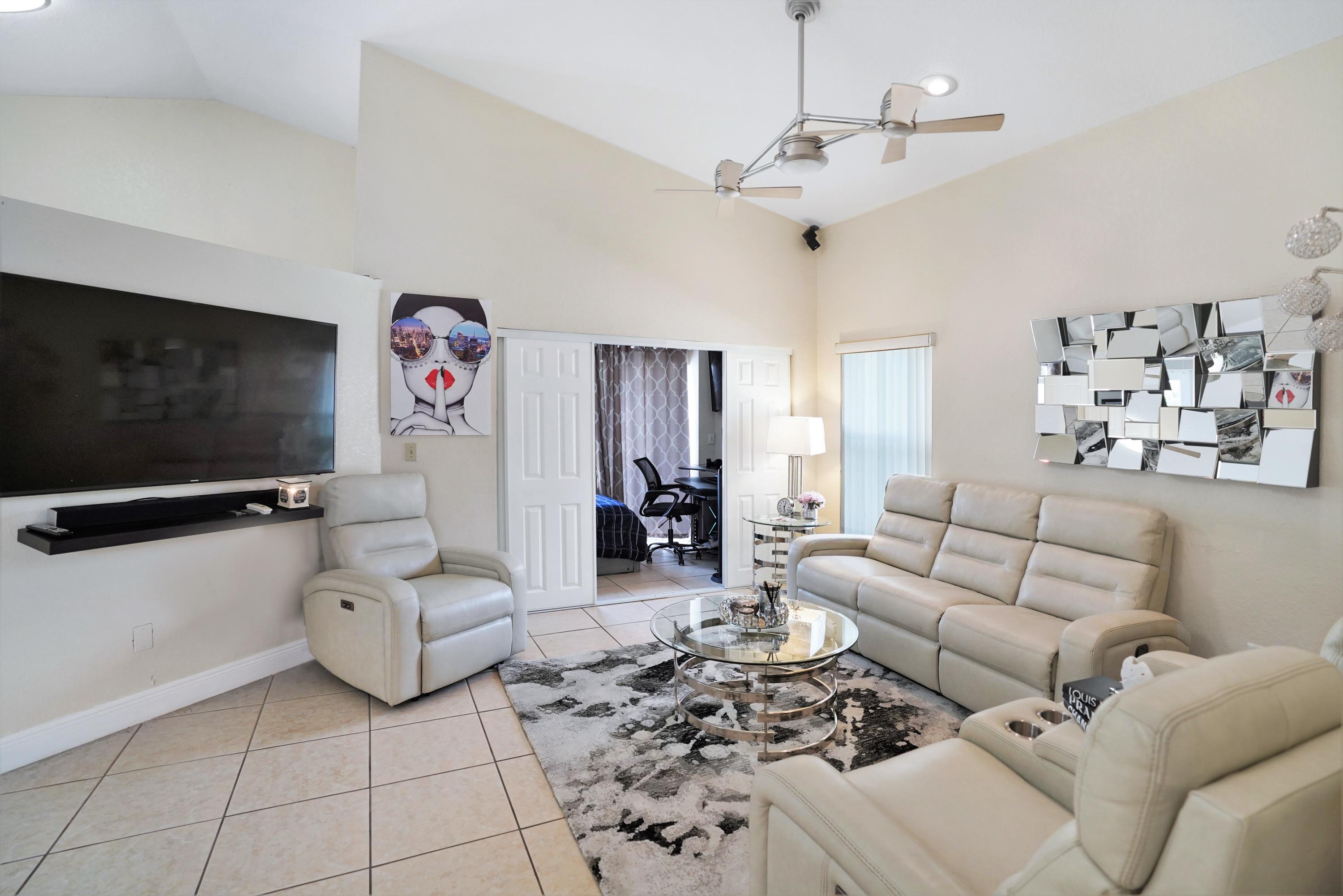 14001 Oak Ridge Drive Davie, FL 33325 - Photo 15 of 41 a living room with furniture and a flat screen tv