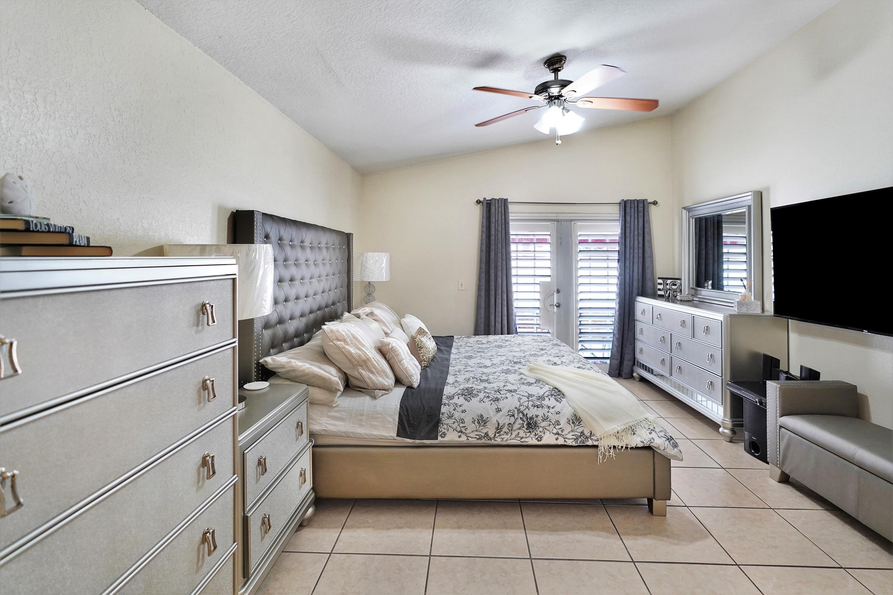 14001 Oak Ridge Drive Davie, FL 33325 - Photo 25 of 41 a living room with furniture and a flat screen tv