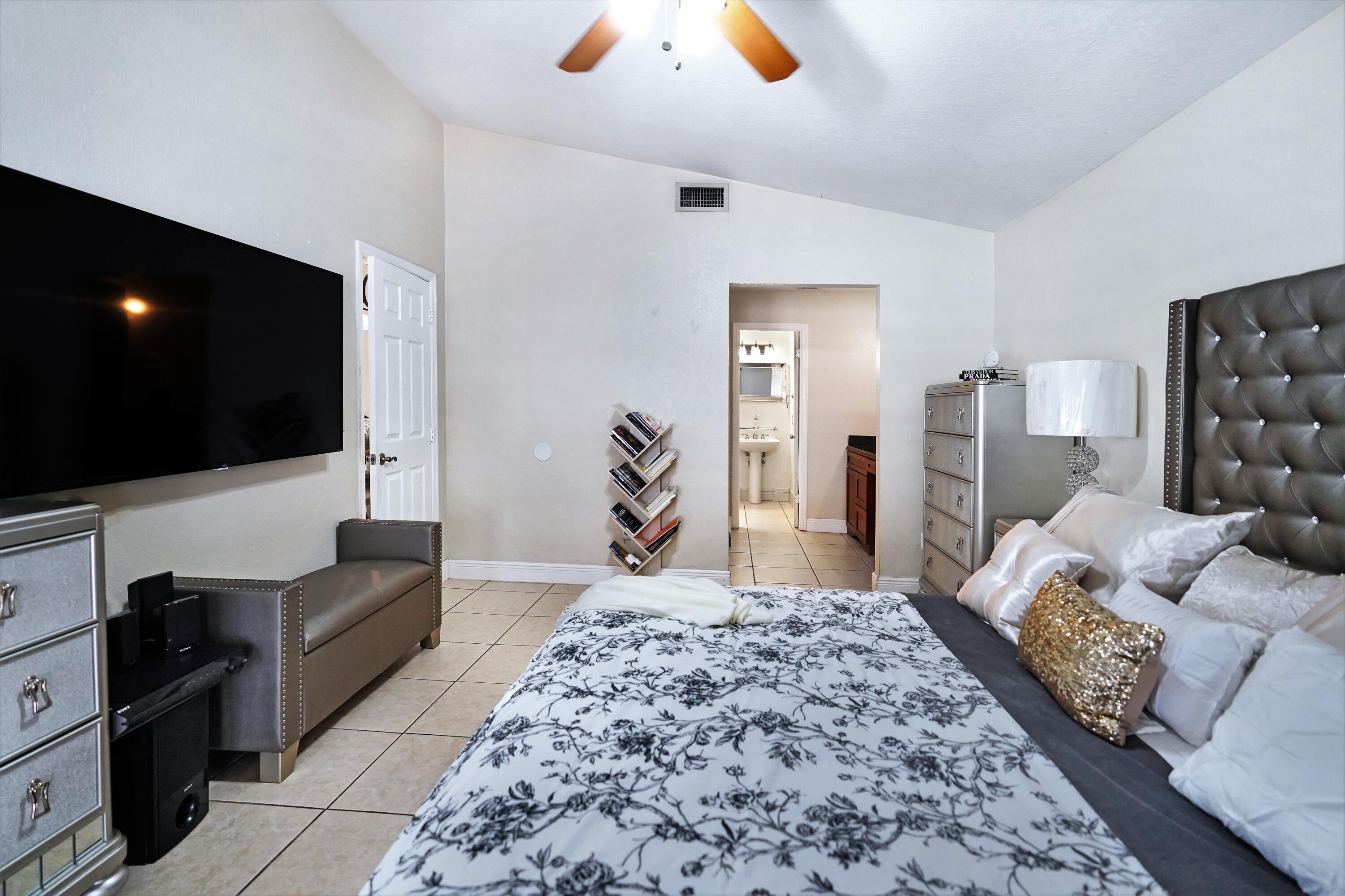 14001 Oak Ridge Drive Davie, FL 33325 - Photo 26 of 41 a living room with furniture and a flat screen tv