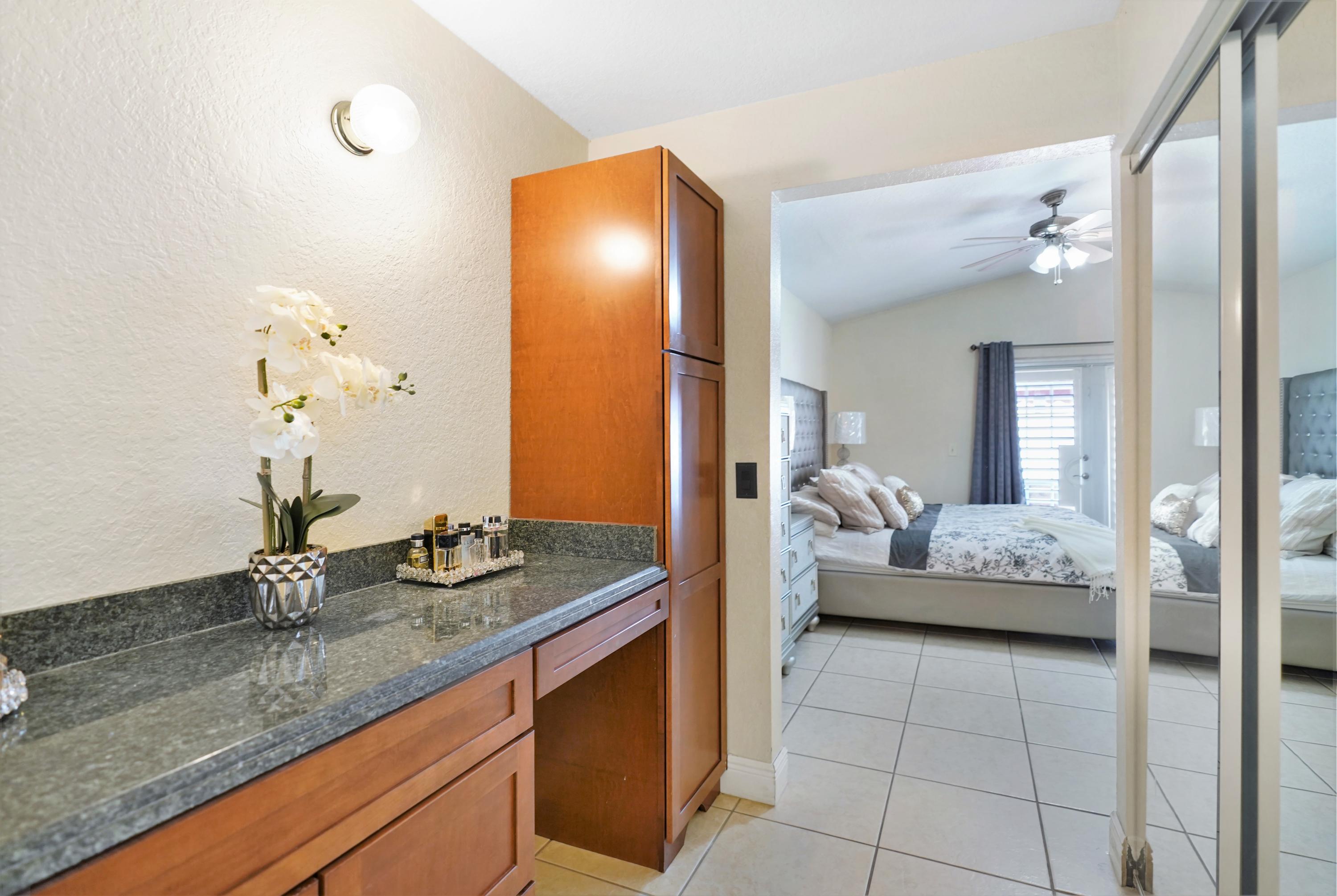14001 Oak Ridge Drive Davie, FL 33325 - Photo 28 of 41 a en suite bathroom with a granite countertop sink and a mirror