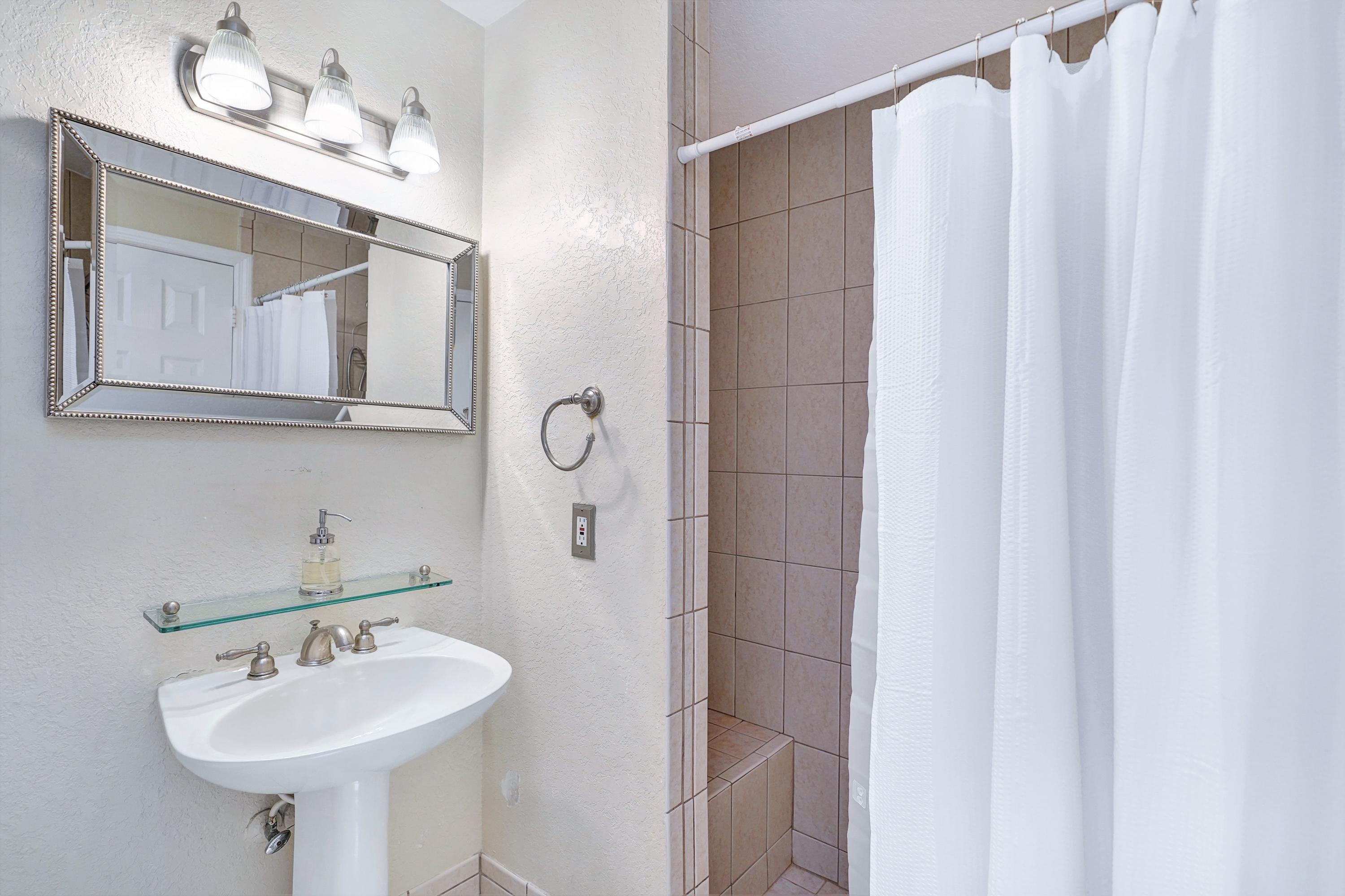 14001 Oak Ridge Drive Davie, FL 33325 - Photo 30 of 41 a bathroom with a sink and a mirror
