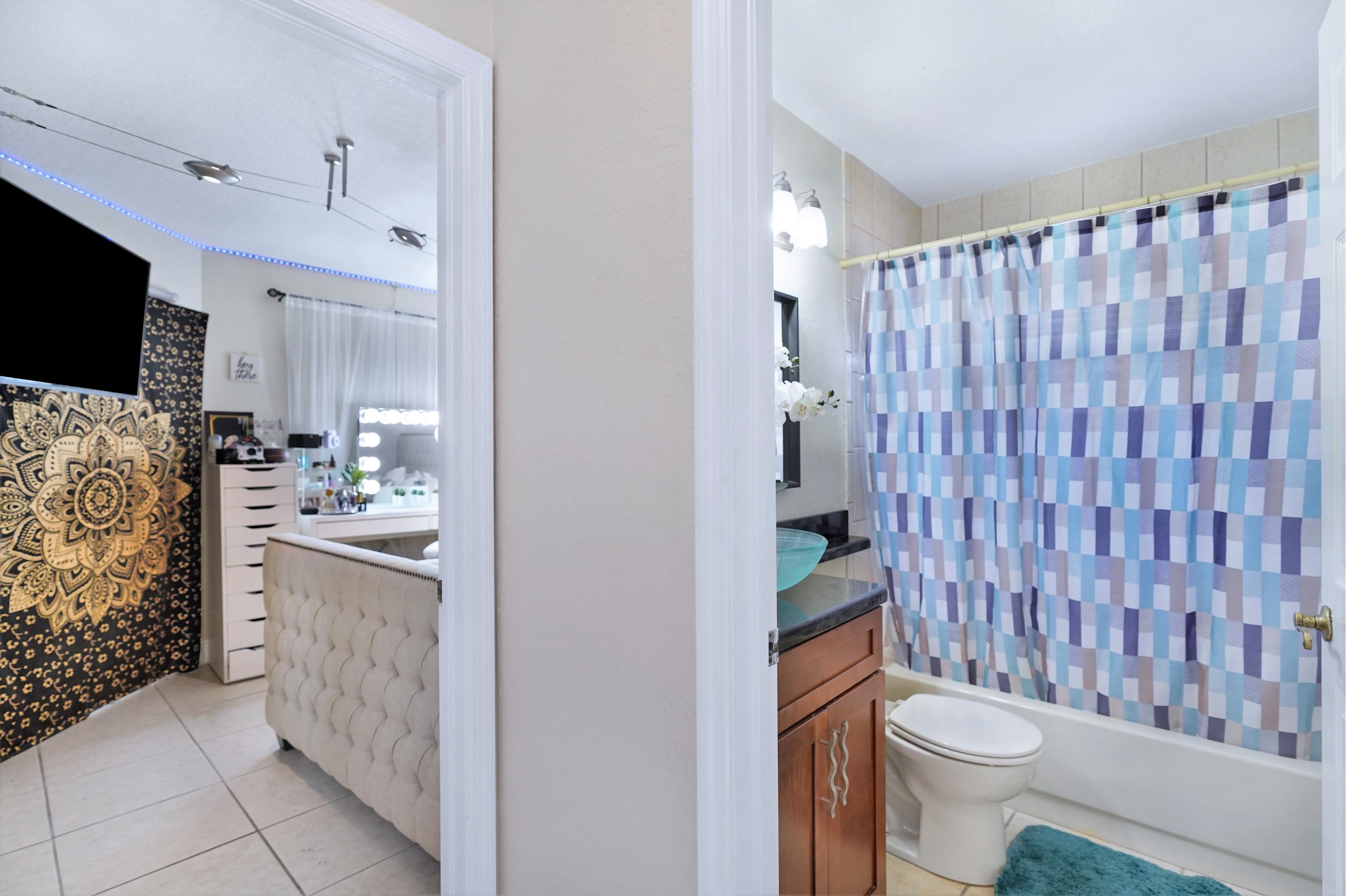 14001 Oak Ridge Drive Davie, FL 33325 - Photo 34 of 41 a bathroom with a sink toilet and shower