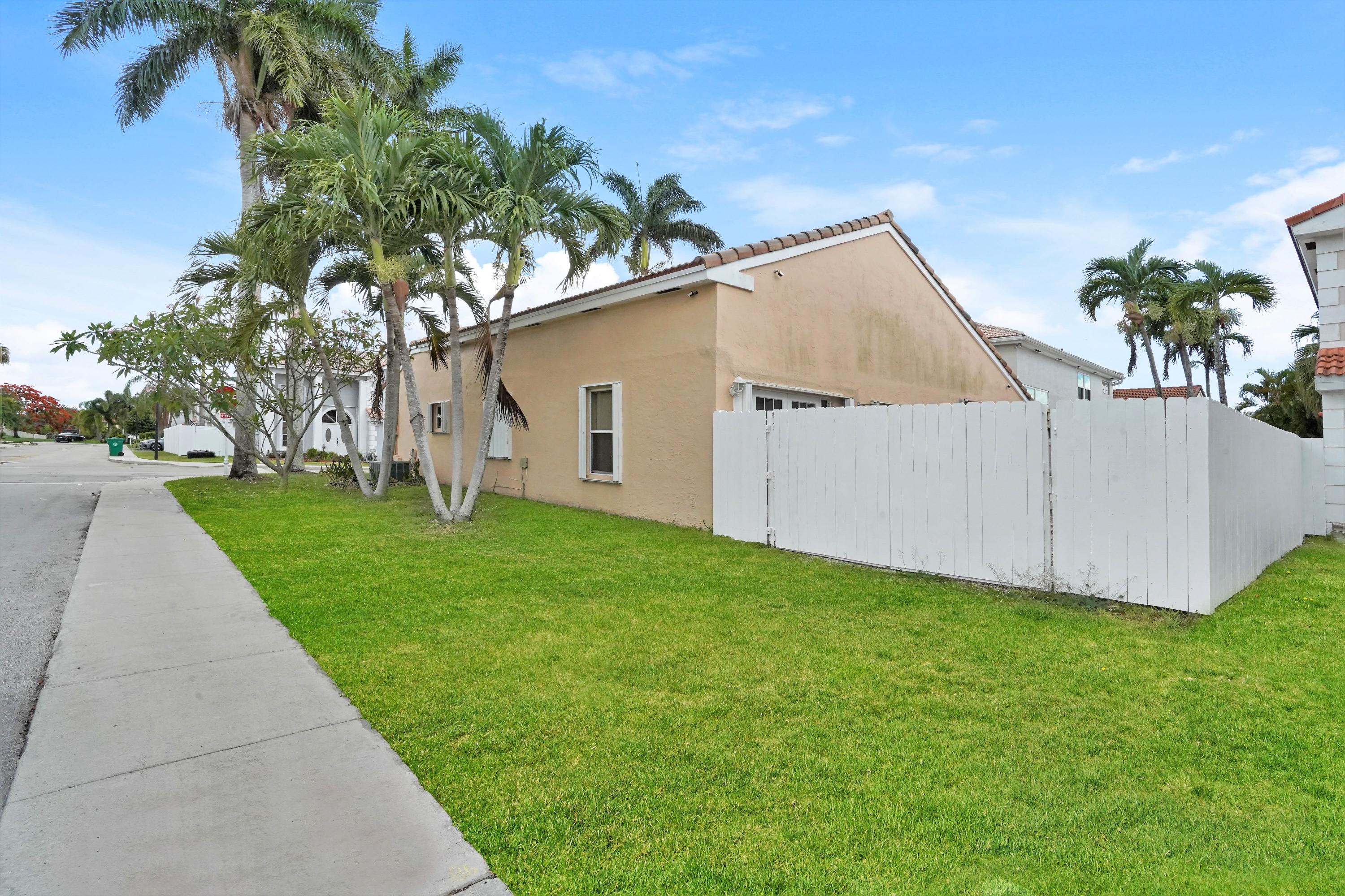 14001 Oak Ridge Drive Davie, FL 33325 - Photo 5 of 41 a view of a house with a yard