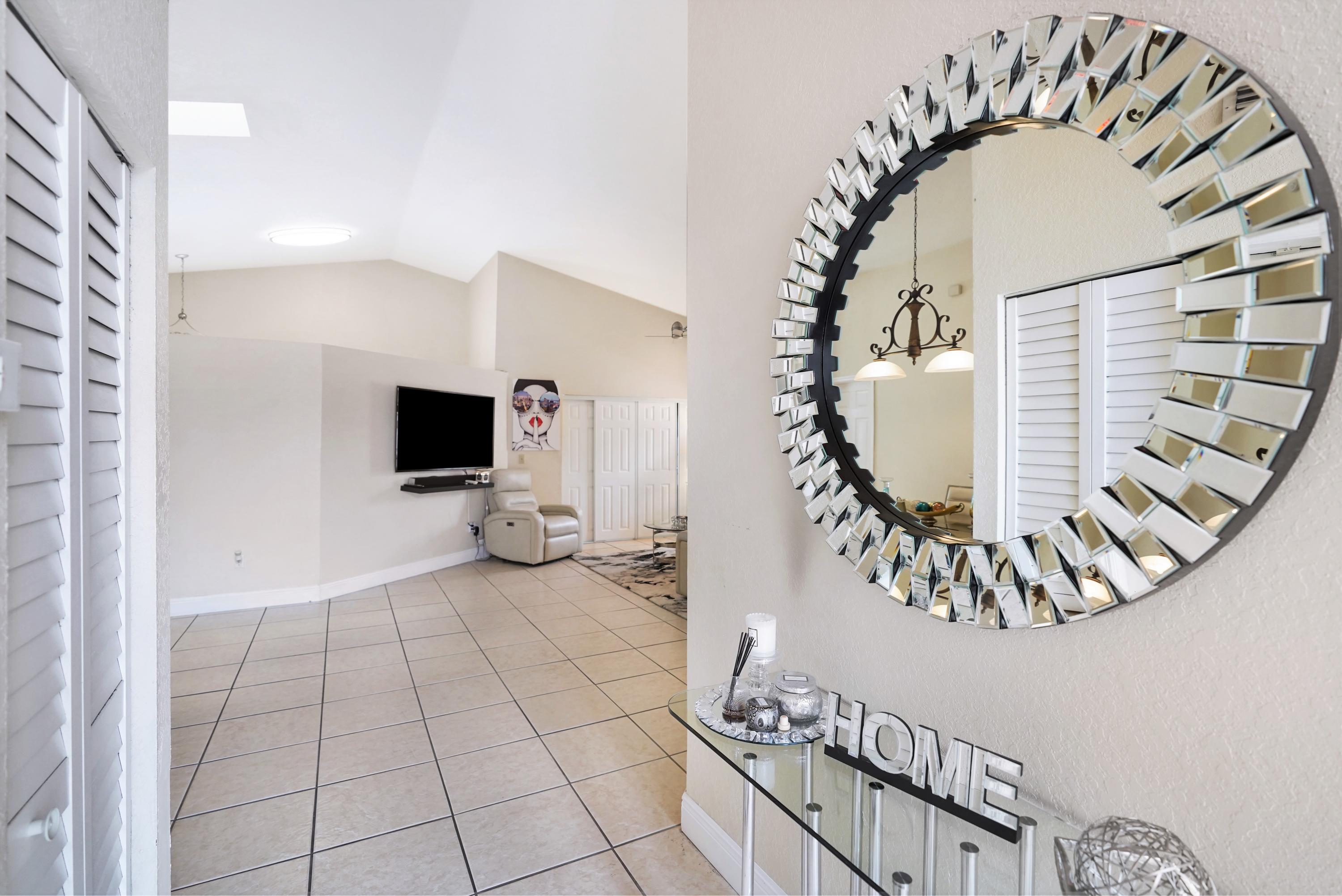 14001 Oak Ridge Drive Davie, FL 33325 - Photo 7 of 41 a view of an entryway with wooden floor