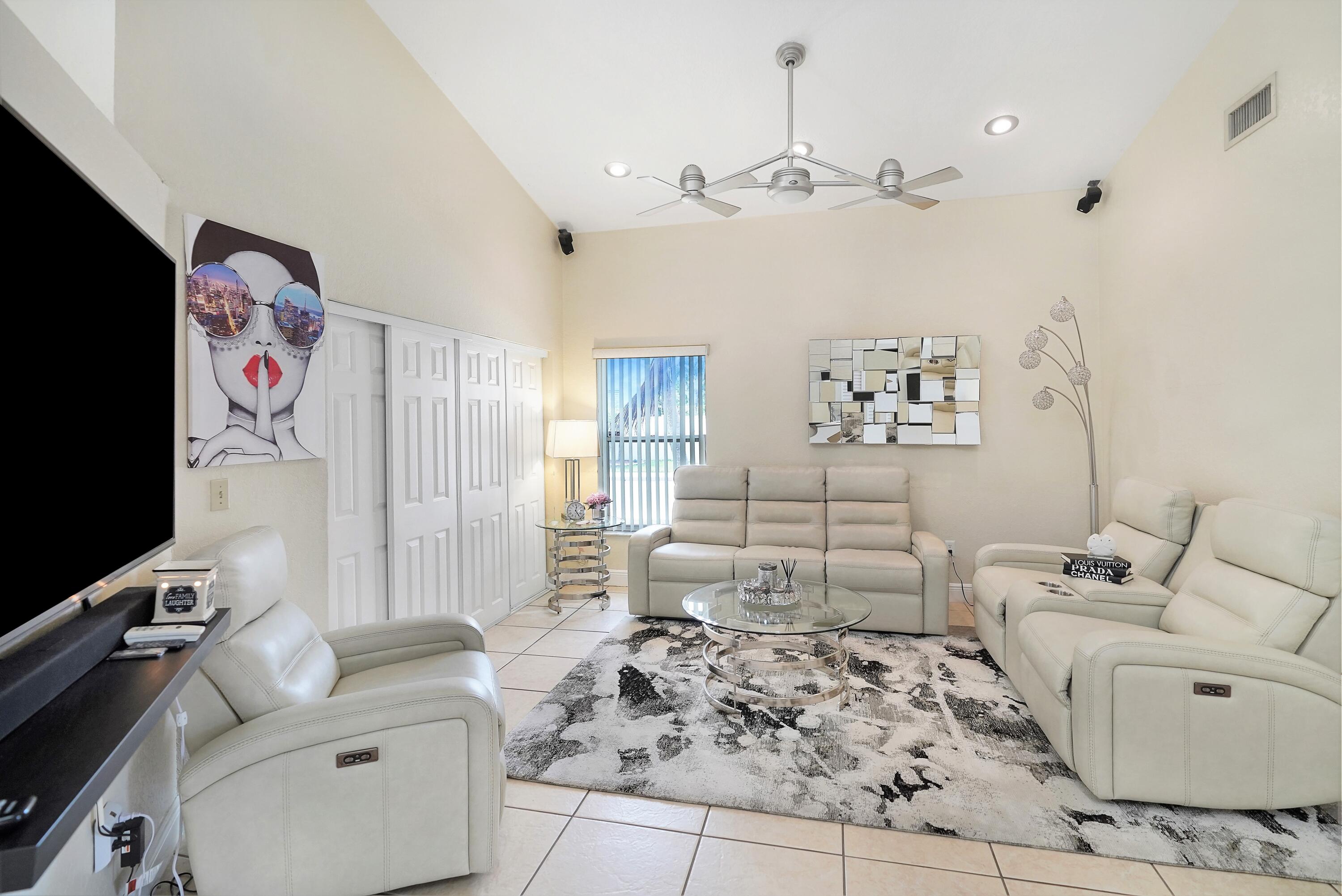 14001 Oak Ridge Drive Davie, FL 33325 - Photo 10 of 41 a living room with furniture and a flat screen tv