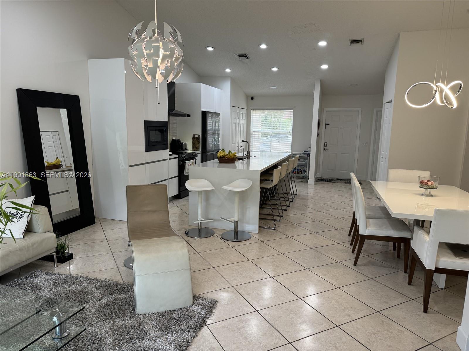 2002 Andromeda Lane Fort Lauderdale, FL 33327 - Photo 4 of 11 a view of a dining room with furniture