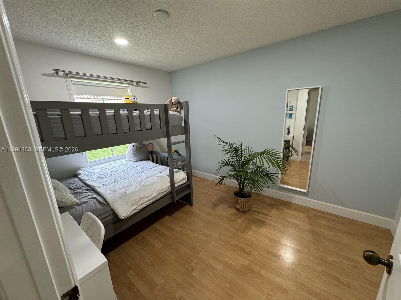 2002 Andromeda Lane Fort Lauderdale, FL 33327 - Photo 7 of 11 a room with furniture and a potted plant