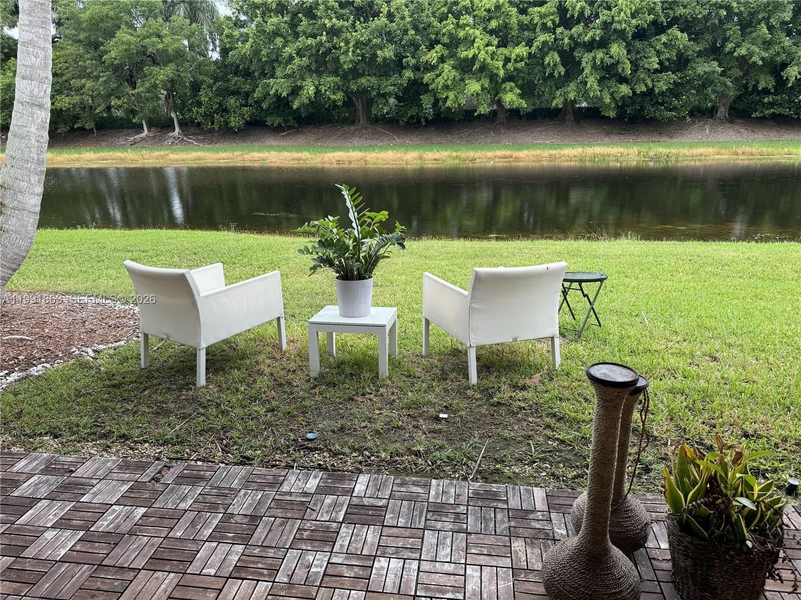 2002 Andromeda Lane Fort Lauderdale, FL 33327 - Photo 10 of 11 a view of yard with green space and seating
