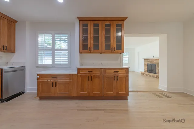 a view of a kitchen with granite countertop cabinets