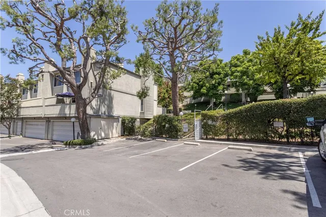 a front view of a house with a road