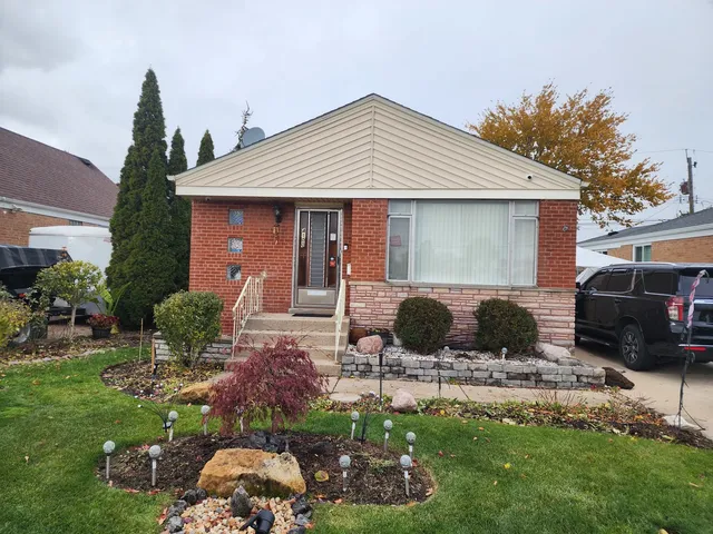 a view of a house with backyard sitting area and fire pit