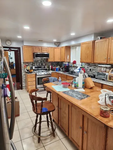 a kitchen with stainless steel appliances a stove a sink dishwasher and cabinets