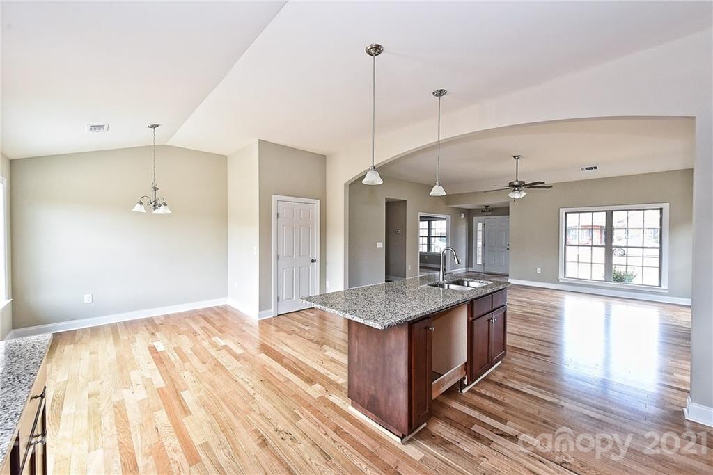 3324 Sincerity Road, Unit 6 Monroe, NC 28110 - Photo 15 of 29 a spacious kitchen with stainless steel appliances granite countertop a sink and oven