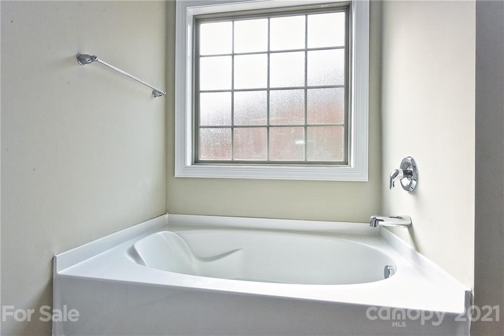 3324 Sincerity Road, Unit 6 Monroe, NC 28110 - Photo 20 of 29 a bathroom with a bathtub