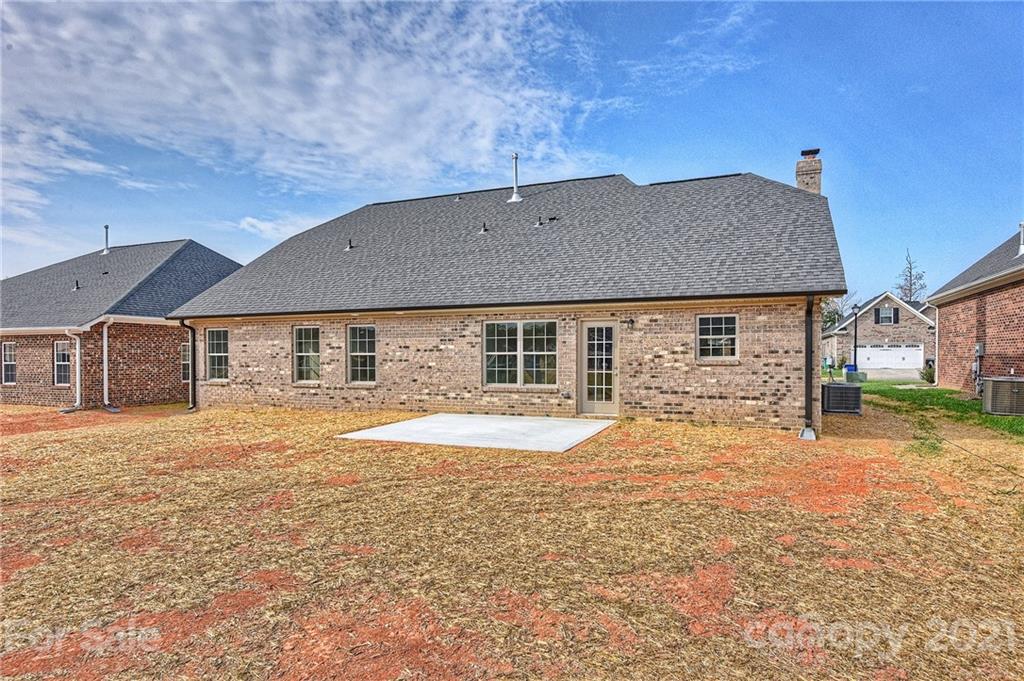 3324 Sincerity Road, Unit 6 Monroe, NC 28110 - Photo 29 of 29 a front view of a house with a yard and garage