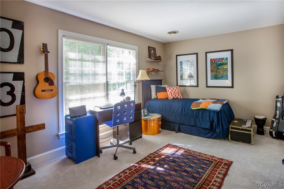 4401 Uppingham Road Richmond, VA 23235 - Photo 15 of 23 a living room with furniture a rug and a window