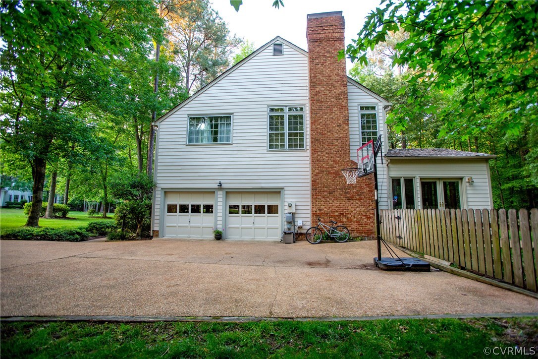 4401 Uppingham Road Richmond, VA 23235 - Photo 20 of 23 a view of a house with a yard and tree s