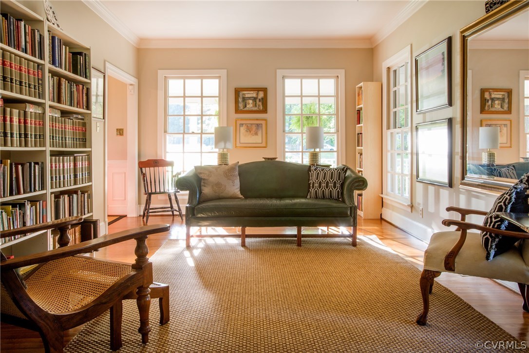 4401 Uppingham Road Richmond, VA 23235 - Photo 6 of 23 a living room with furniture a bookshelf and a window