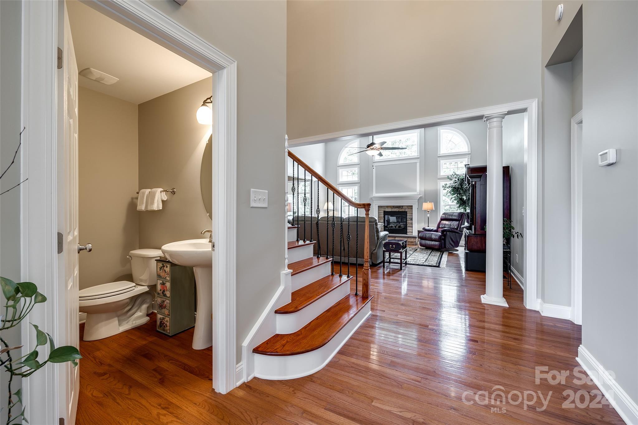 352 Calming Way Tega Cay, SC 29708 - Photo 11 of 48 a living room with furniture and a wooden floor