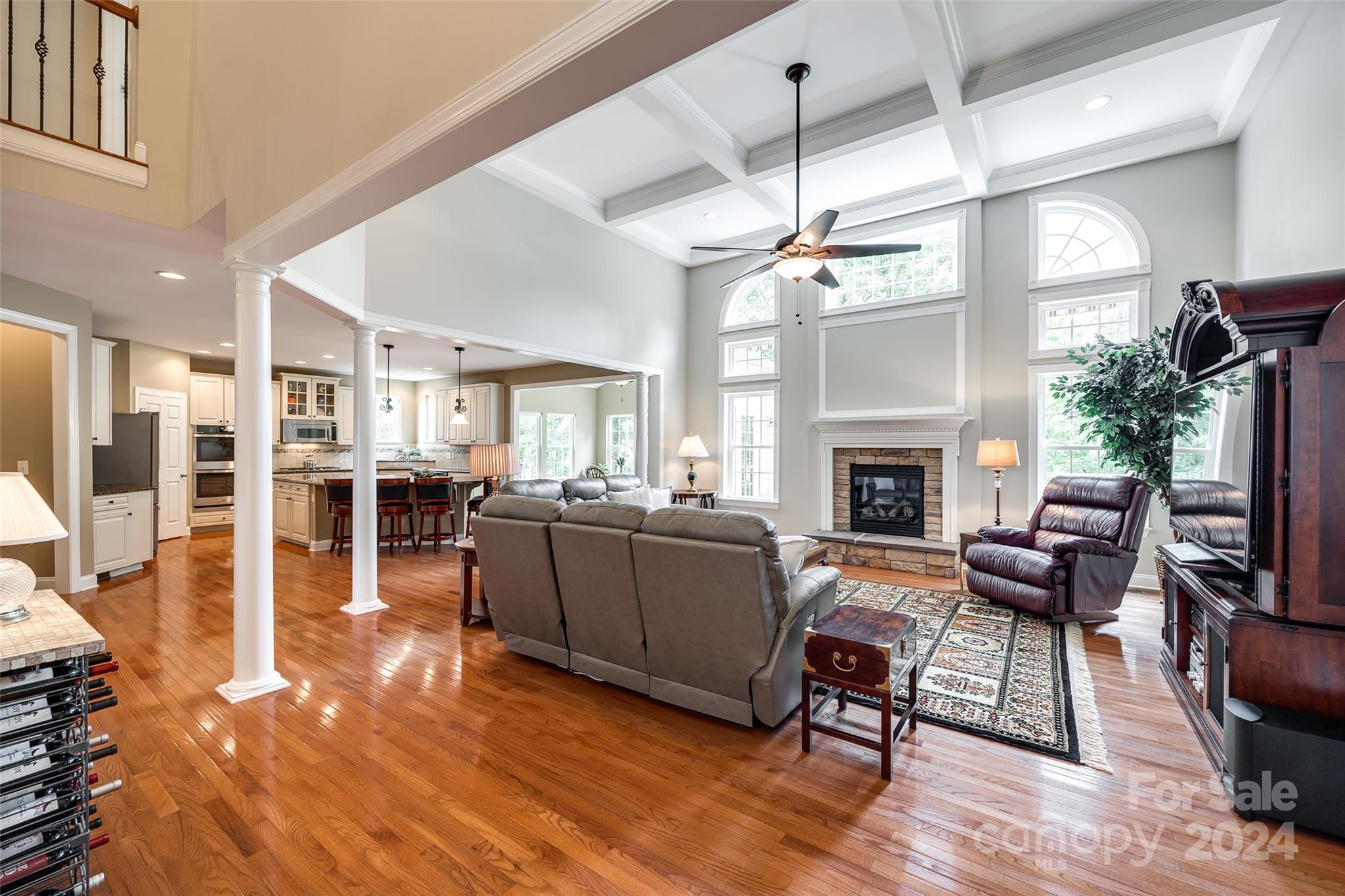 352 Calming Way Tega Cay, SC 29708 - Photo 12 of 48 a living room with furniture a fireplace and a flat screen tv