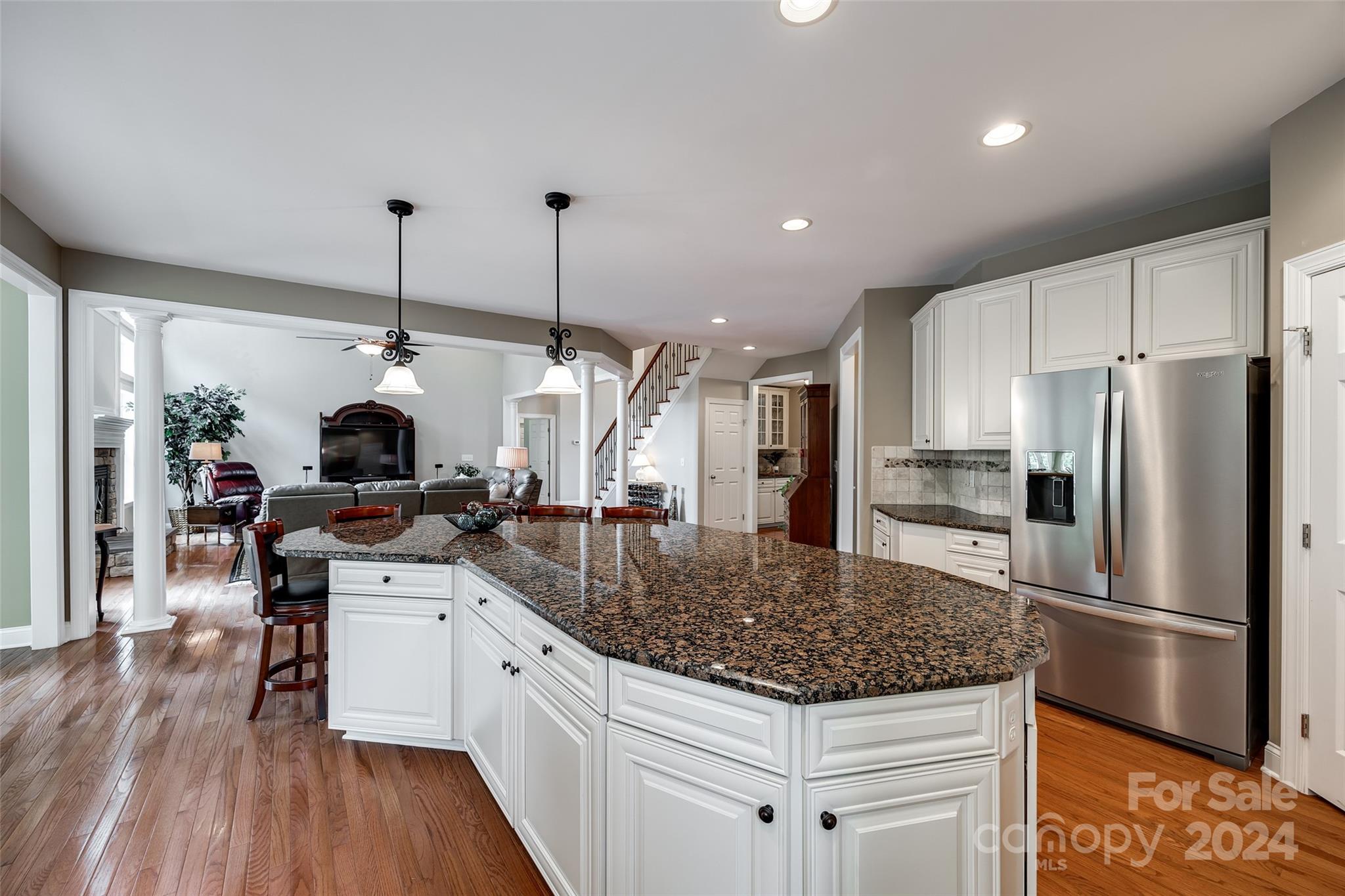 352 Calming Way Tega Cay, SC 29708 - Photo 17 of 48 a kitchen with stainless steel appliances granite countertop a sink stove and refrigerator
