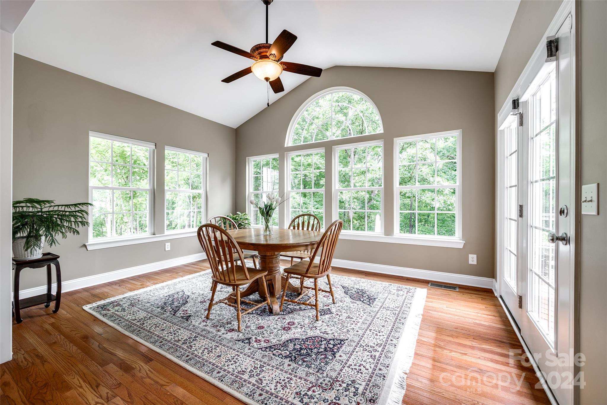 352 Calming Way Tega Cay, SC 29708 - Photo 18 of 48 a view of a dining room with furniture window and wooden floor