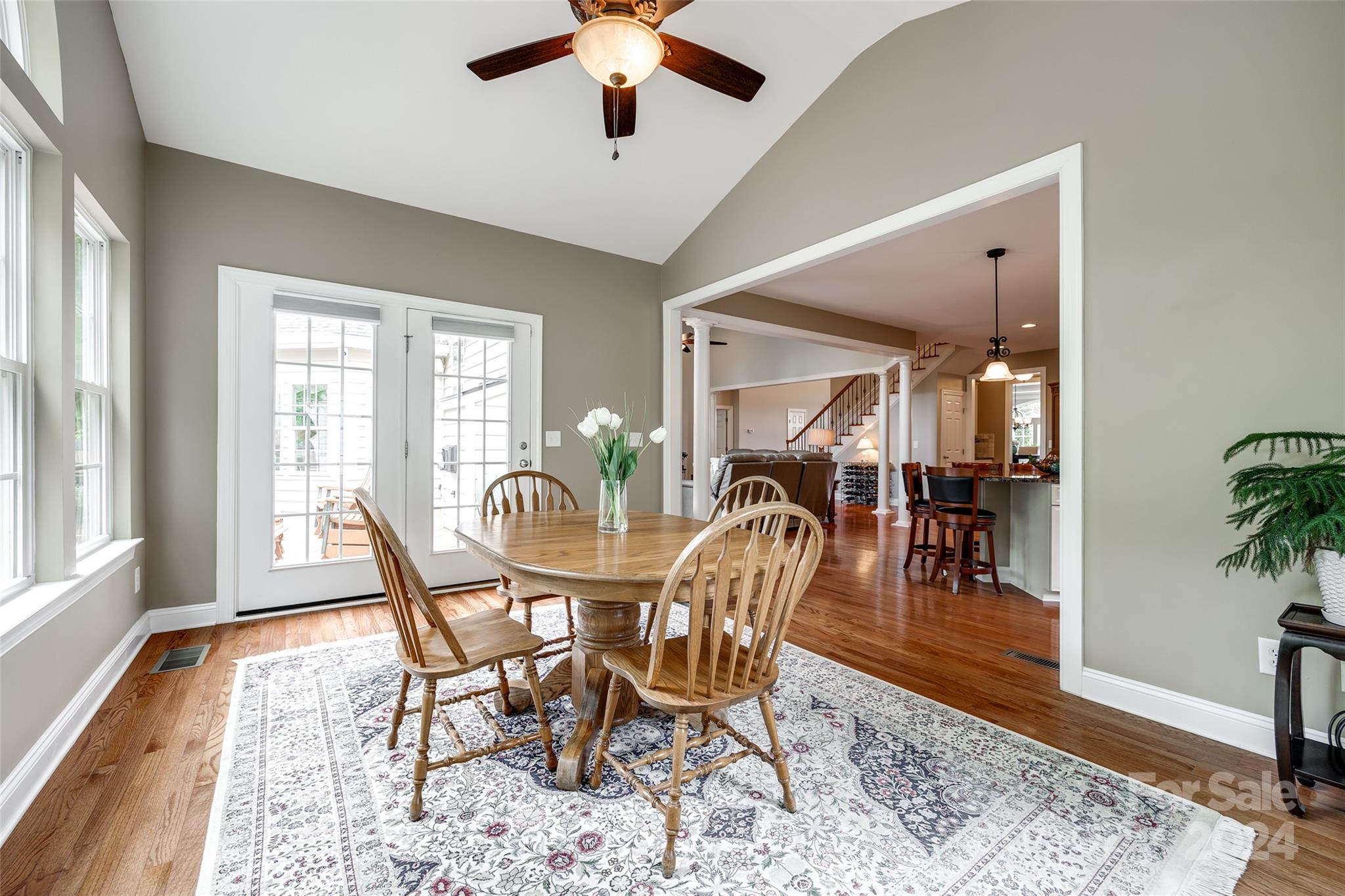 352 Calming Way Tega Cay, SC 29708 - Photo 19 of 48 a view of a dining room with furniture window and wooden floor