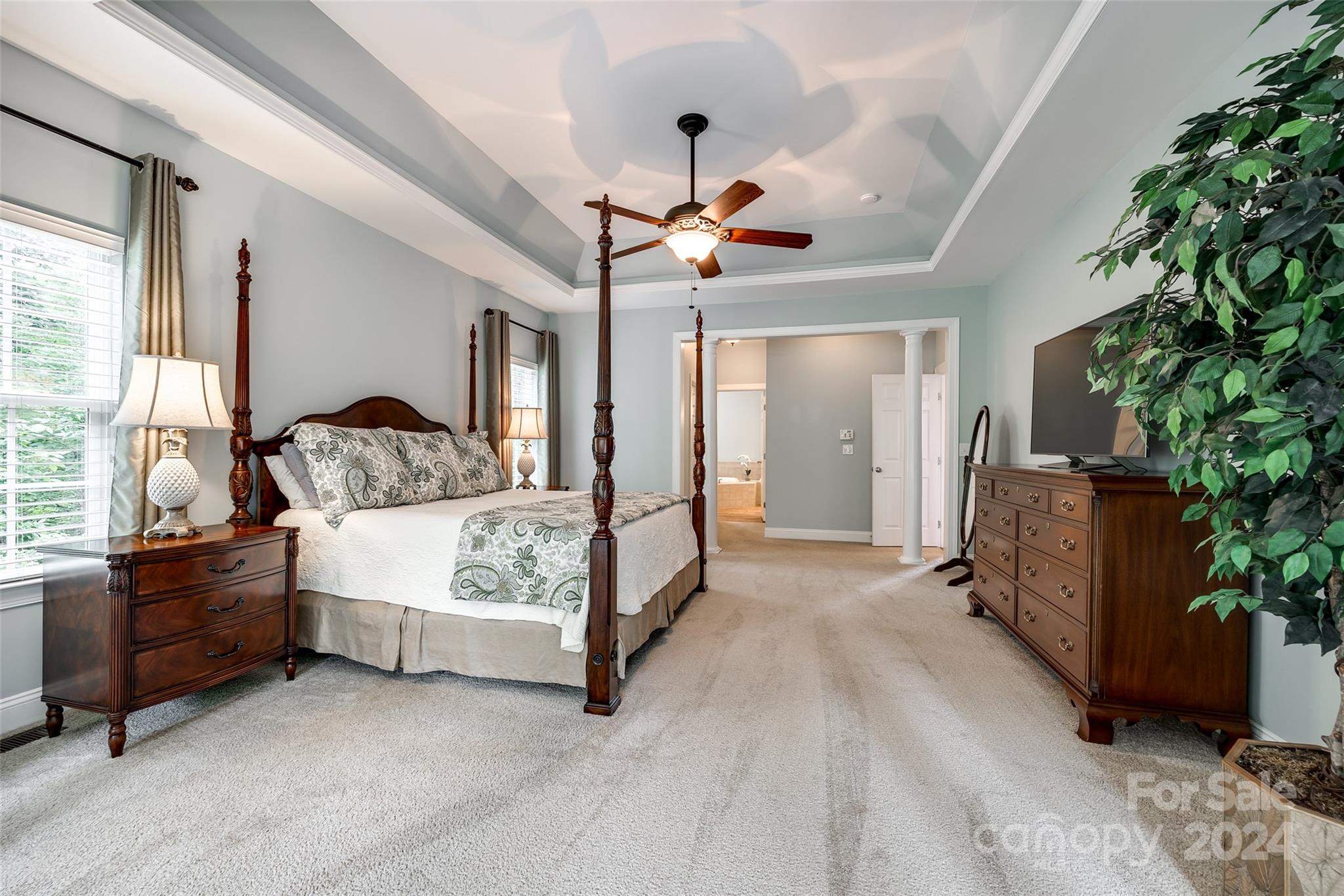 352 Calming Way Tega Cay, SC 29708 - Photo 22 of 48 a spacious bedroom with a bed and a couch