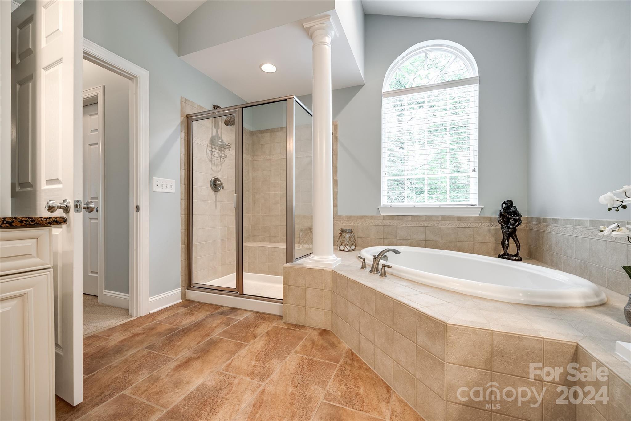 352 Calming Way Tega Cay, SC 29708 - Photo 24 of 48 a spacious bathroom with sink shower and a bathtub