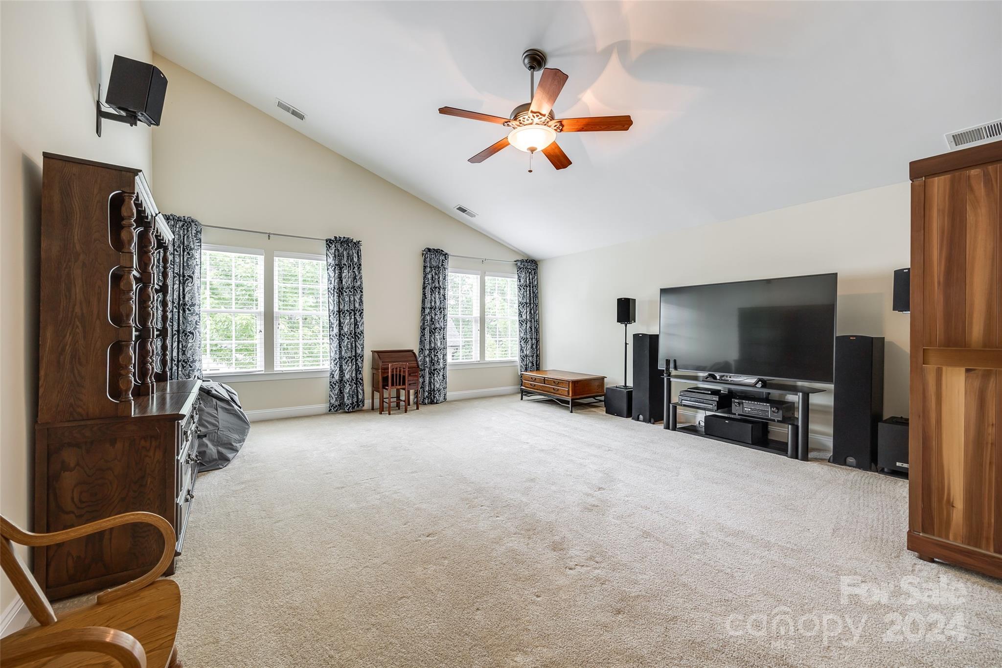 352 Calming Way Tega Cay, SC 29708 - Photo 28 of 48 a view of a livingroom with furniture and a flat screen tv